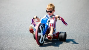 A young boy rides in the Big Wheel Race