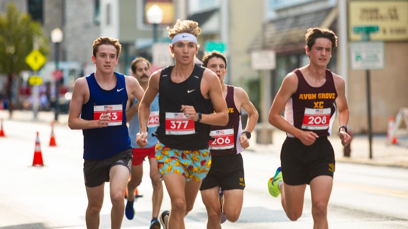 Boys cross-country team runners competing at Good Neighbor Day